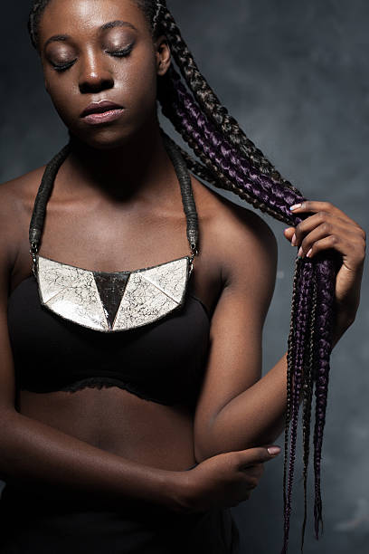 istock african woman with very long hair braided in multi-colored braid 486856132