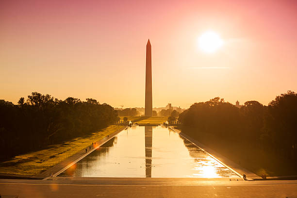 Washington Monument from the Lincoln Memorial Washington DC Monument and the US Capitol Building and grounds viewed across the reflecting pool from the Lincoln Memorial on The National Mall USA national monument stock pictures, royalty-free photos & images