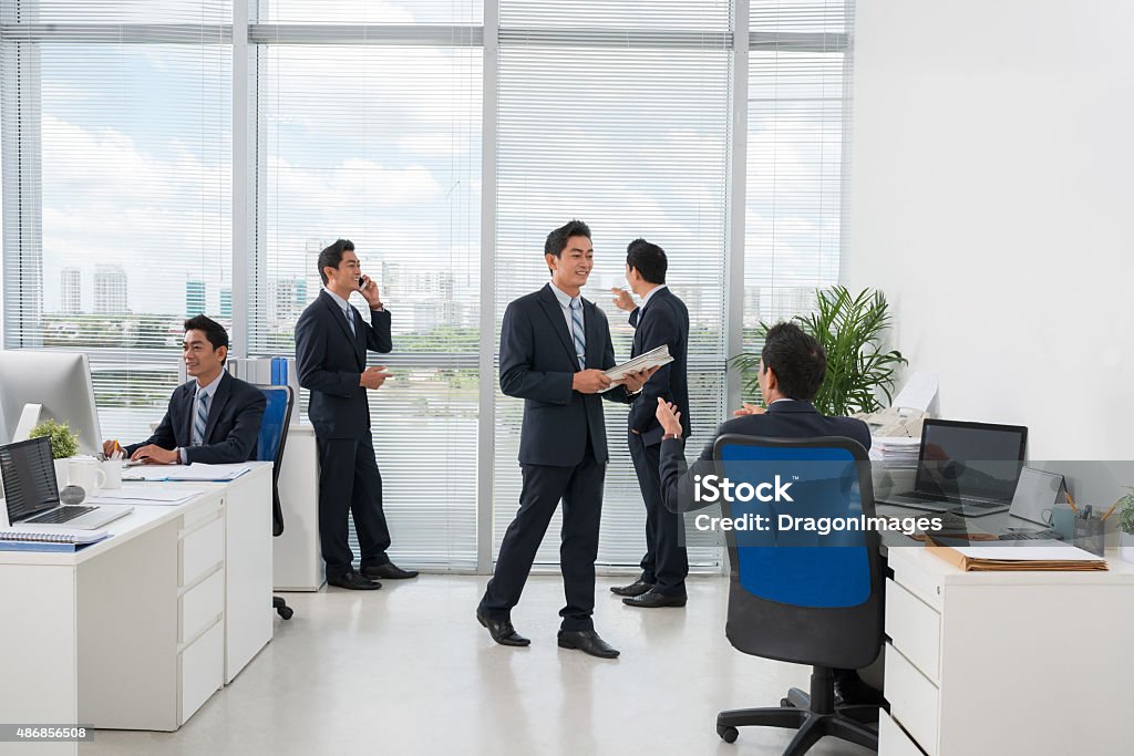 Office routine Typical day of office manager working in the office Cloning Stock Photo
