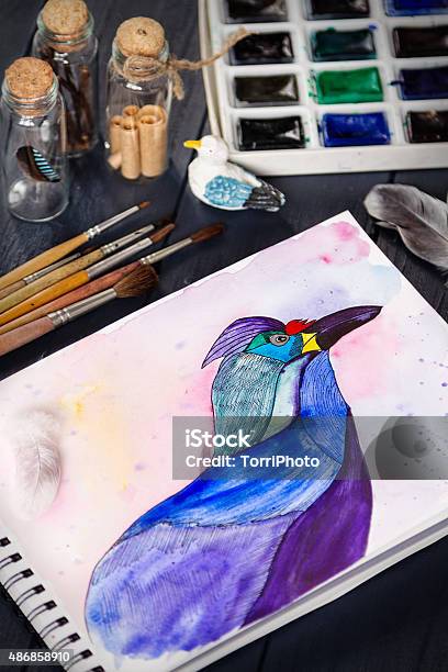 Watercolor Painting Of Blue Bird And Artistic Tools On Table Stock Photo - Download Image Now - iStock Watercolor Painting Of Blue Bird And Artistic Tools On Table Stock Photo - Download Image Now - Istock
