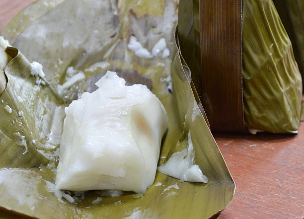 istock steamed flour with coconut filling on banana leaf 486860036