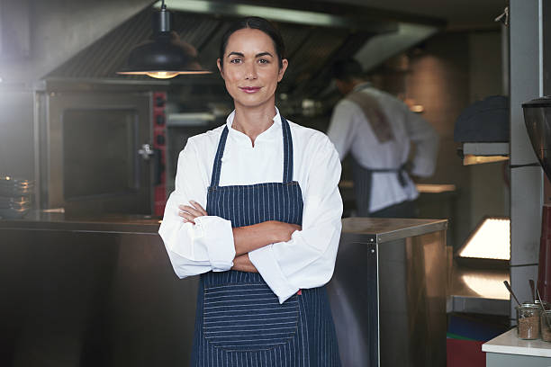 My chefs know how to cook Cropped portrait of a chef standing with her arms folded in the kitchenhttp://195.154.178.81/DATA/i_collage/pu/shoots/805551.jpg chef stock pictures, royalty-free photos & images