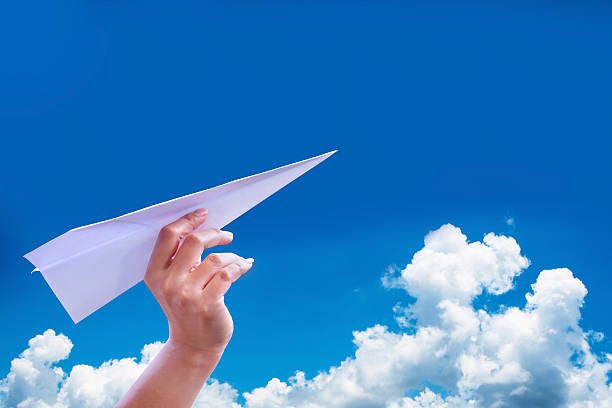 istock Hand aircraft paper fold to success for design rocket paper 486860974