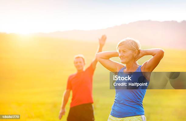 Senior Couple Running Stock Photo - Download Image Now - 2015, 60-69 Years, Active Lifestyle