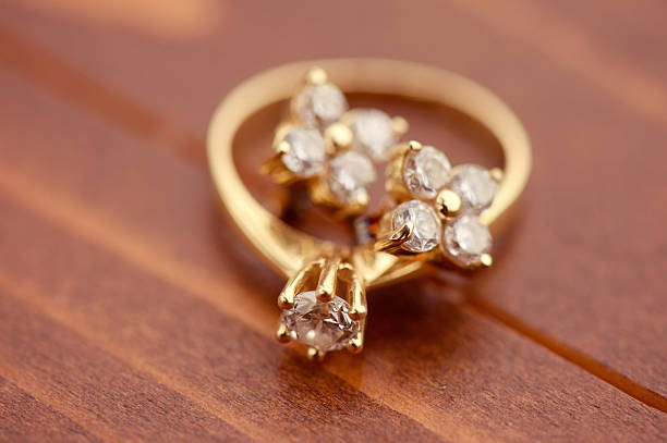 istock Engagement ring with golden earrings 486862118