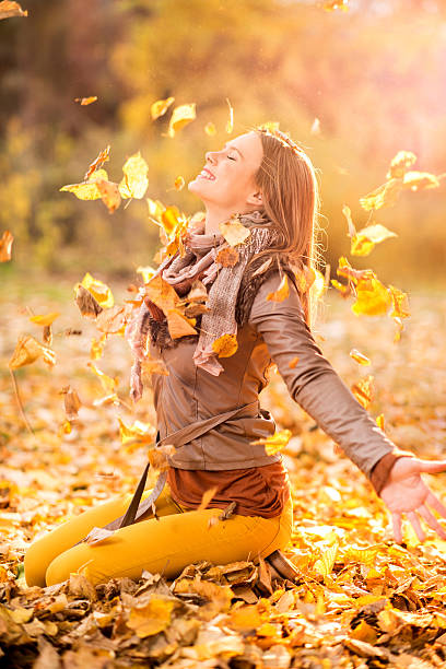 istock Smiling girl enjoying in autumn park. 486862186