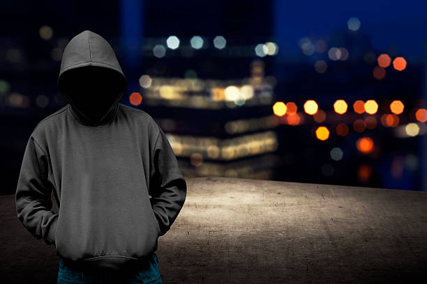 istock Faceless man in hood on the rooftop 486864006