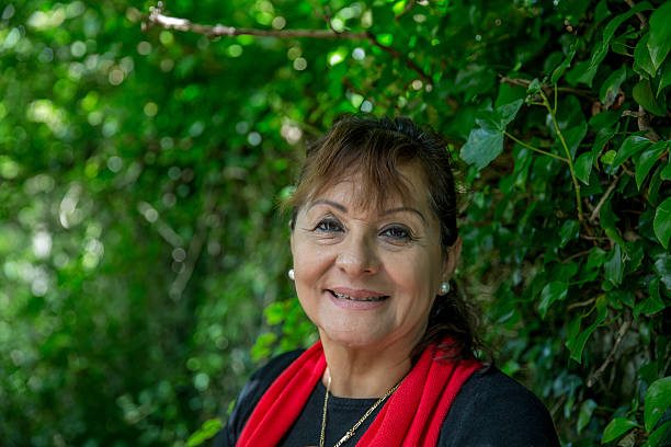 istock Vivacious mature smiling hispanic woman portrait 486864514