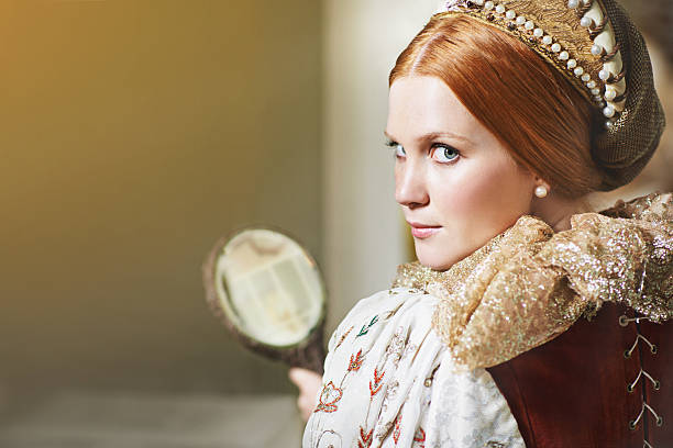 Shot of an elegant noble woman admiring herself in a mirror in her palace roomhttp://195.154.178.81/DATA/i_collage/pi/shoots/784228.jpg