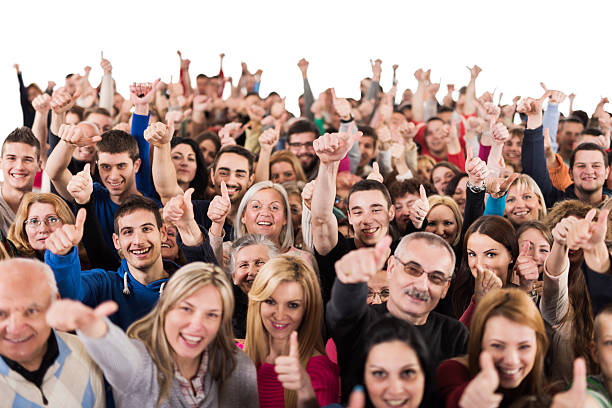 istock Crowd of people showing thumb up and looking at camera. 486865098