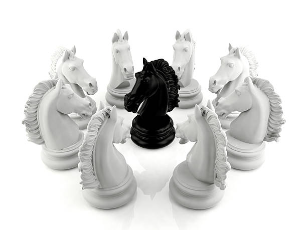 istock Black knight chess surrounded by a group of white knight chess 486865494