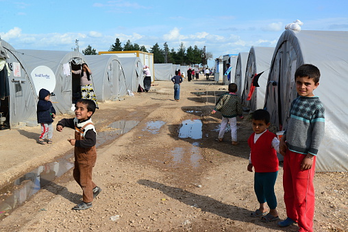 Suruc, Turkey - April 3, 2015: Unnamed  syrian (kurdish) people in refugee camp in Suruc. These people are refugees from Kobane and escaped because of Islamic state attack. 