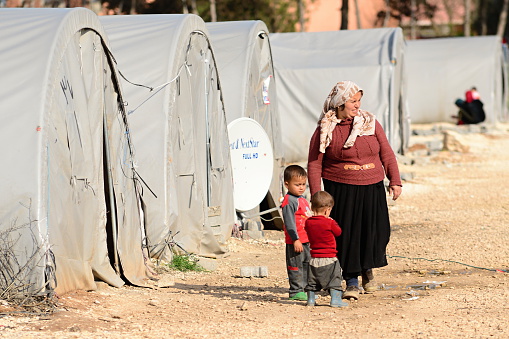 Suruc, Turkey - April 3, 2015: Unnamed  syrian (kurdish) people in refugee camp in Suruc. These people are refugees from Kobane and escaped because of Islamic state attack. 
