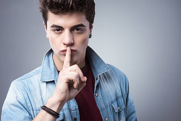 istock Teenager boy making silence gesture 486868664