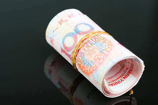 Close up view of China money on black background.