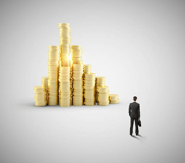 istock businessman looking at coin 486871270