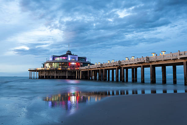 The Pier illuminated at night. City of Blankenberge, West Flanders, Belgium