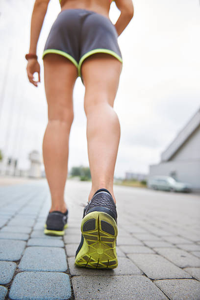 Low section of running woman