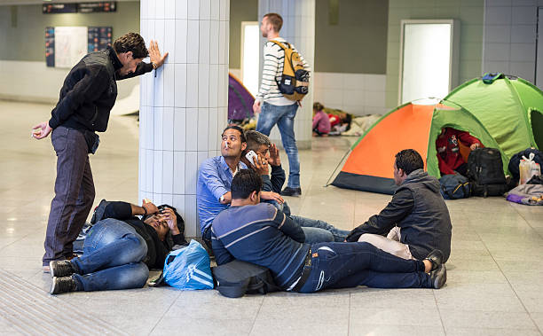 Budapest , Hungary - September 10, 2015: Report of refugees from Syria, Pakistan, Afghanistan in the railway station Budapest Keleti of Hungary.All they are looking for a better opportunity to live better, away from poverty and being killed simply for being Catholic. Here in this picture you can see the actual situation in this place.