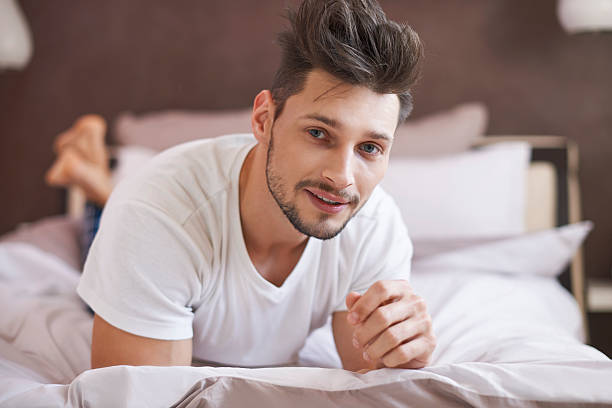 istock Pensive man relaxing at his cosy bedroom 486872776