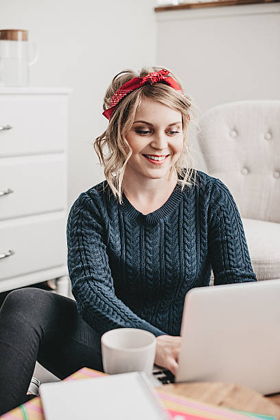 istock Young woman doing her homework at home 486873676