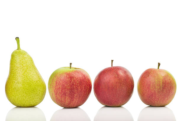 istock One pear among apples isolated on white background 486874212