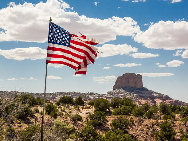 istock Mountain peak with flag in the foreground 486875062