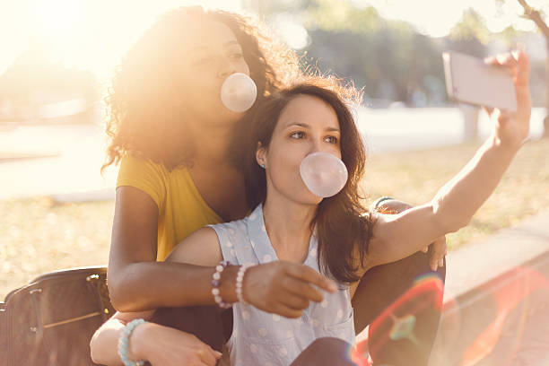 istock Girls taking selfie in the park 486875412