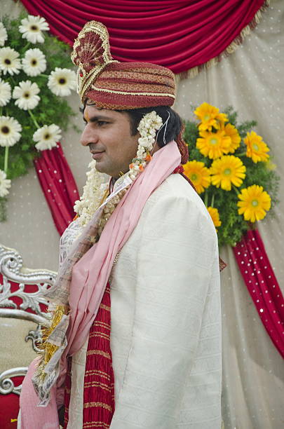 istock Happy handsome indian groom at his wedding. 486876364