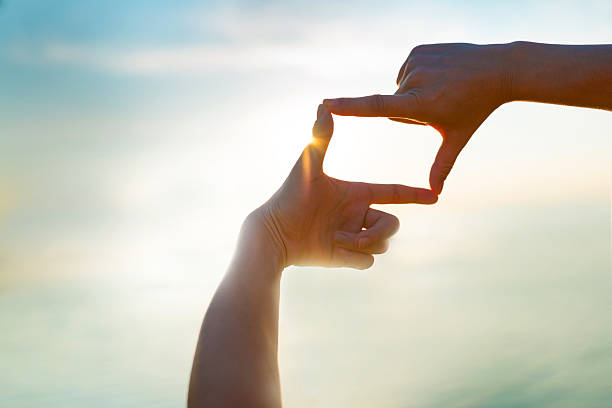  capturing the sunset by the water - Finger Frame