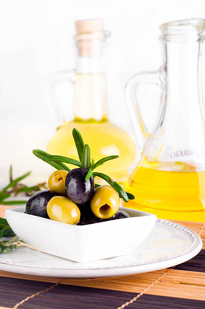 istock Olive oil and olive branch on the table 486876810