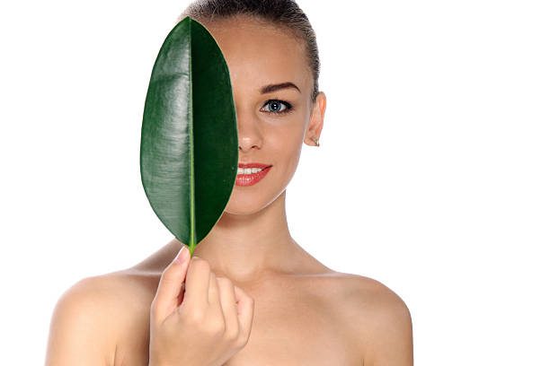 istock Happy woman with green leaf 486877202