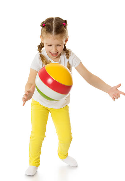 istock little girl playing with a ball 486877356