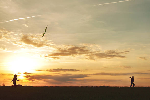 istock man with a girl launches a kite 486877718
