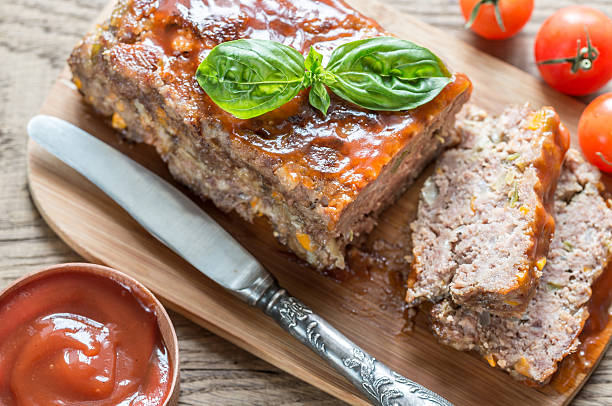 istock Meat loaf with barbecue sauce on the wooden board 486877862