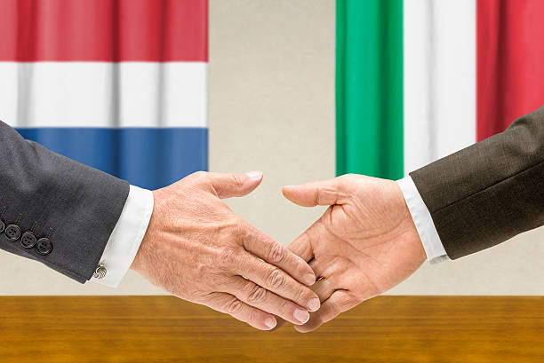 istock Representatives of the Netherlands and Italy shake hands 486878762