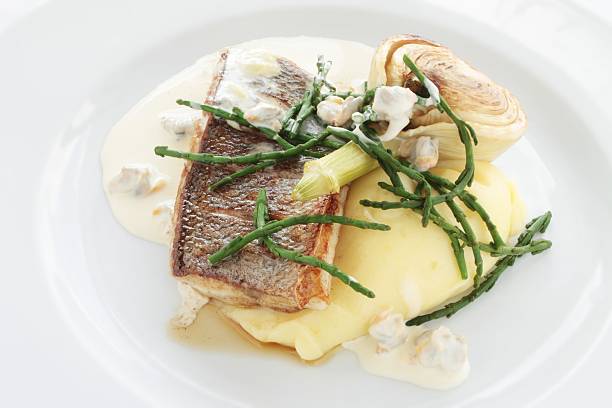 grilled sea bass with samphire and creamed potatoes grilled sea bass with samphire and creamed potatoes salicornia stock pictures, royalty-free photos & images