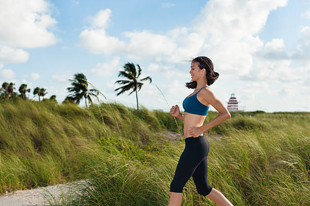 istock Young Woman jogger in South Beach 486879412