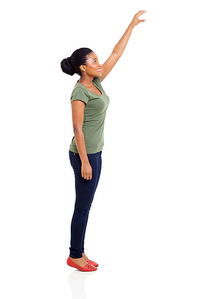 young african girl reaching something high