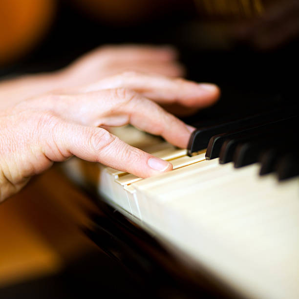 istock Close up of a musician playing piano keyboard 486879585