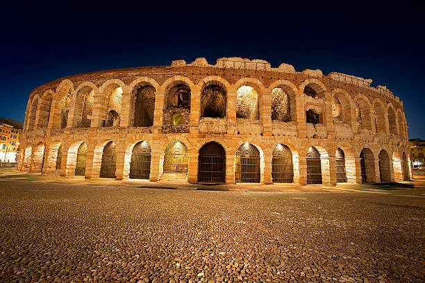 Arena di Verona by Night - Italy Arena of Verona at night, World Heritage, I-III century - Roman amphitheater verona opera stock pictures, royalty-free photos & images