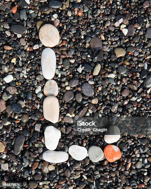 Letters Alphabet Laid On A Black Sand Stock Photo - Download Image Now - 2015, Alphabet, Arts Culture and Entertainment