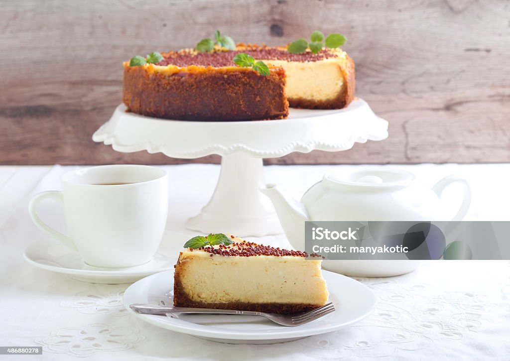 Slice of New York cheesecake Slice of New York cheesecake, served on plate 2015 Stock Photo