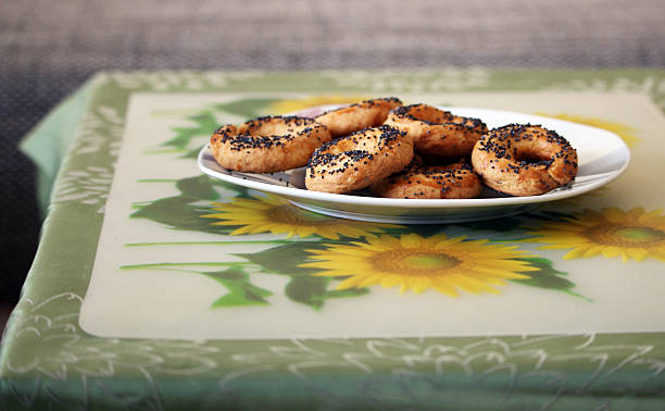 Delicious homemade pretzels with poppy on the table stock photo
