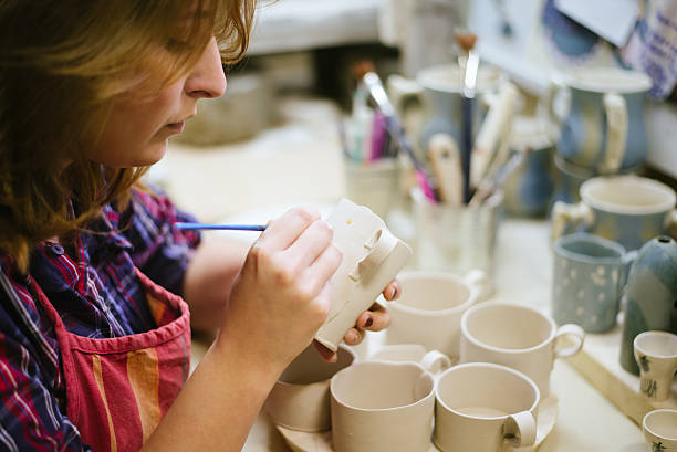 istock Pottery artist painting 486881437