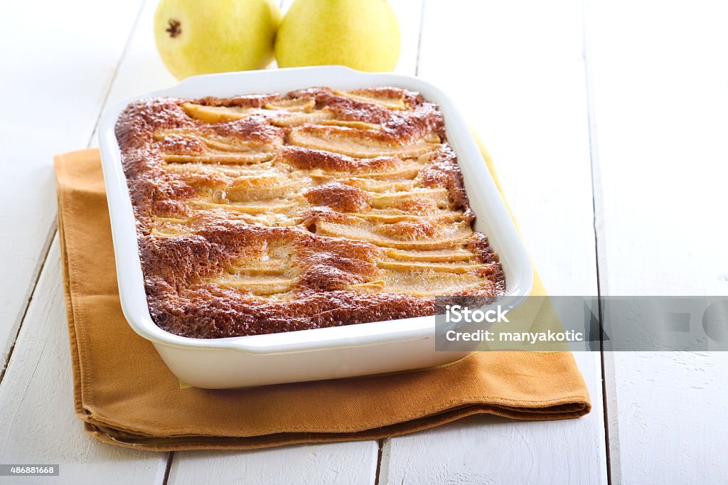 Oatmeal whole wheat pear cake Oatmeal whole wheat pear cake in baking tin 2015 Stock Photo