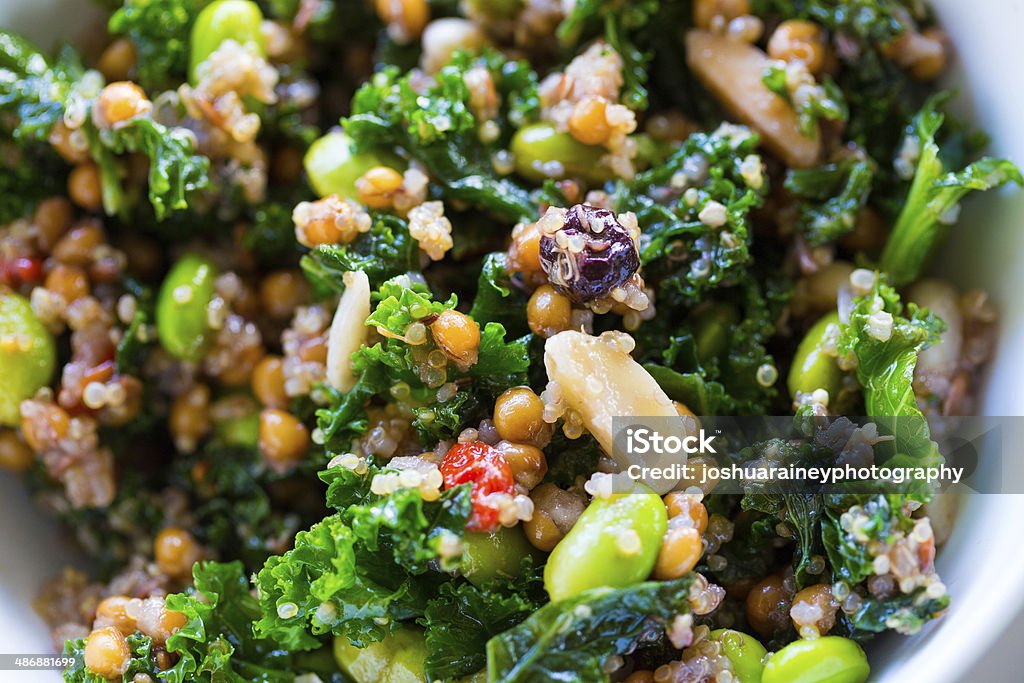 Paleo Diet Quinoa Kale Salad Raw paleo quinoa kale salad in a bowl. Healthy eating diet food. Antioxidant Stock Photo