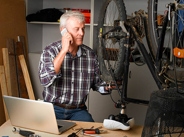 istock Bike shop owner at work 486882664