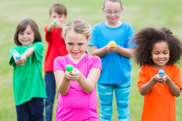 istock Multiracial group of children in an egg spoon race 486883406