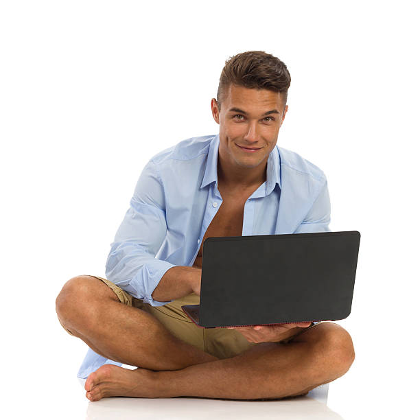 istock Cheerful Handsome Man With Laptop 486883462